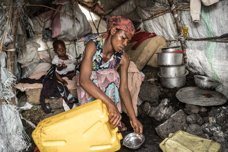 Viviane Nyirarukundo, aged 29, fled her village in Masisi territory. Previously, her two children were in good health but after their arrival in the camp their health started to deteriorate and one of them started to show symptoms of malnutrition. The mother brought him to the MSF’s clinic, and the child recovered but as the difficulty to find food persists, her child plunged once again into a state of malnutrition. Viviane lives alone with her two children, as her husband abandoned her upon learning that she had been raped. She must now fend for herself to find food for her and her two children. Copyright - Michel Lunanga/MSF