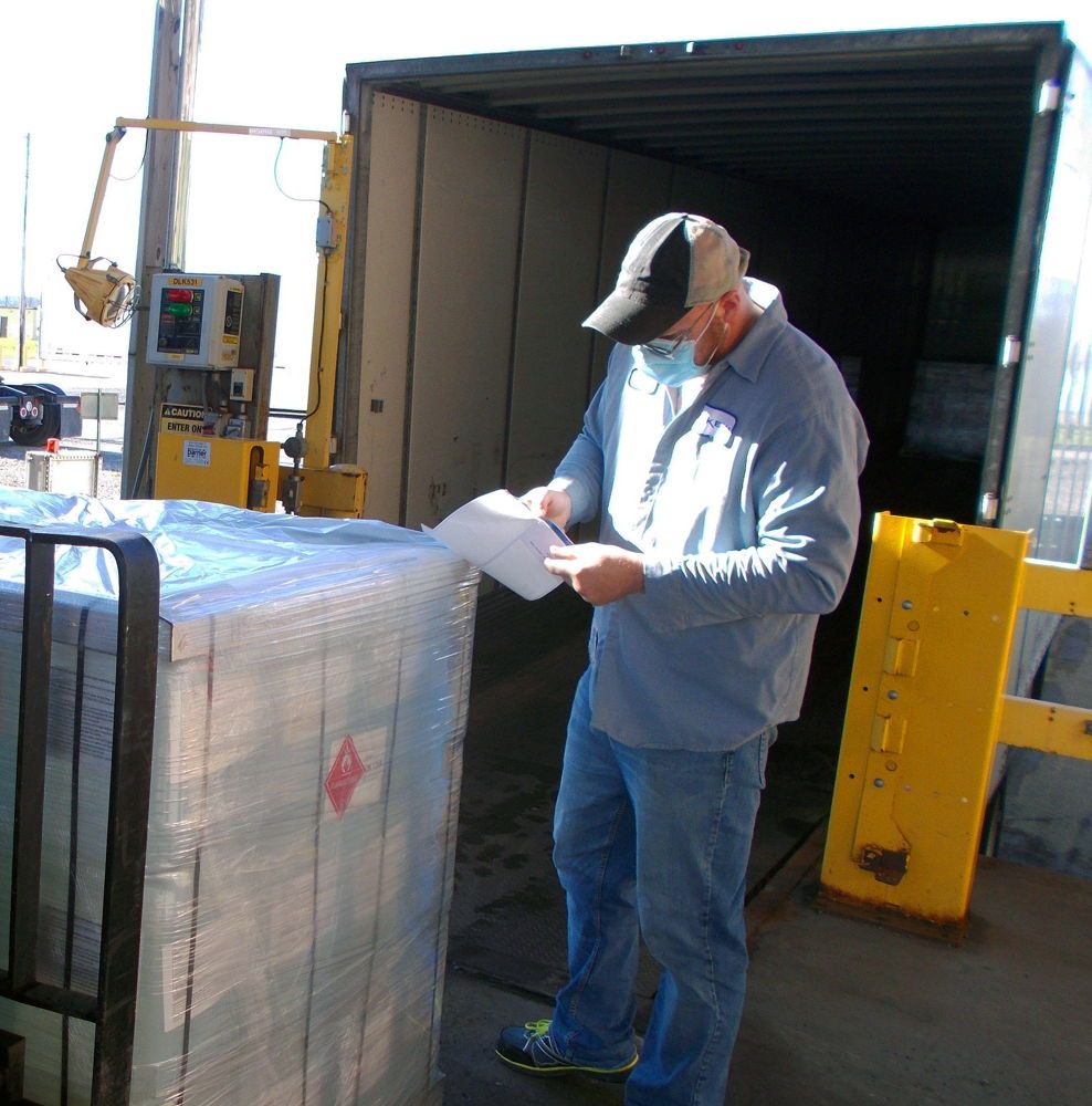 An Arkema employee prepares hand sanitizer solution for shipment from its Geneseo, N.Y. plant to State agencies, to aid in the fight against COVID-19.