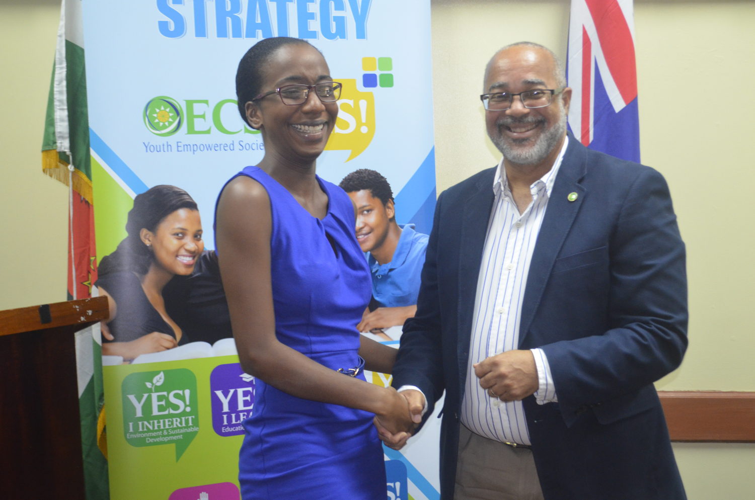 Dr. Jules presents certificate to graduate