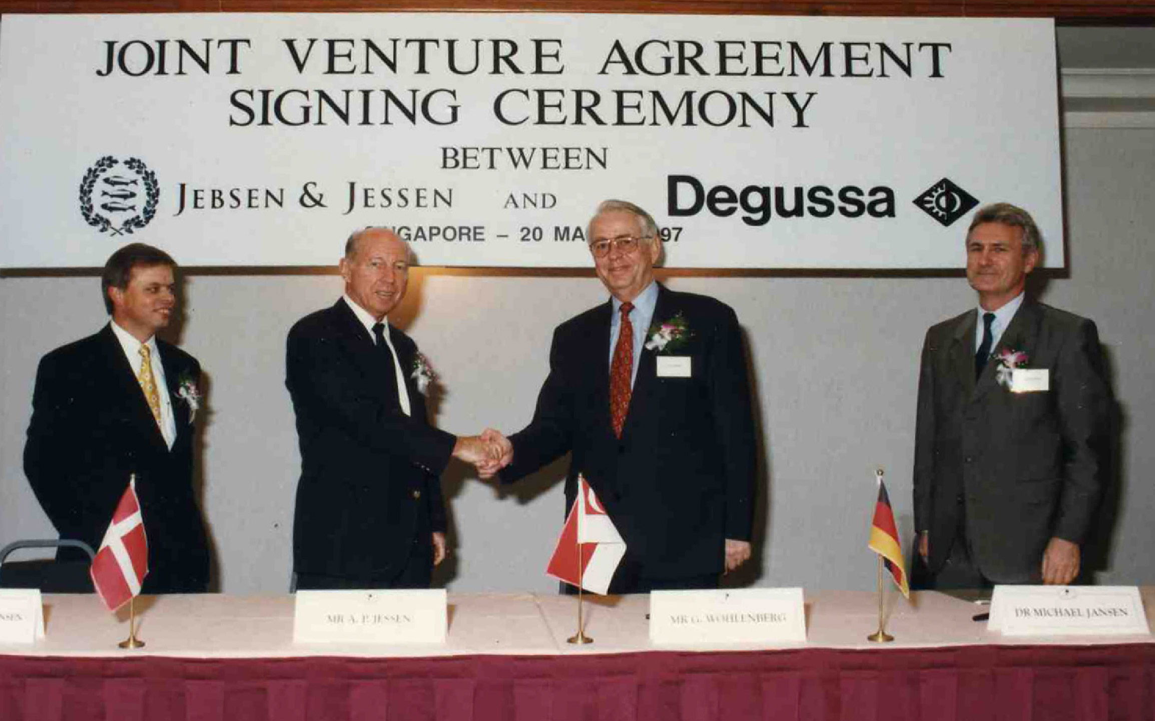 A P Jessen (secondfrom left) at the signing ceremony of the JJ-Degussa joint venture.