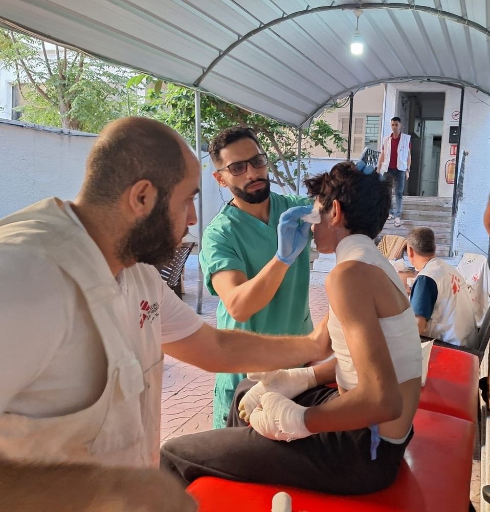 MSF nurse Mohammed Hawajari cleans the wounds of a young boy at the MSF Burns Clinic after he suffered severe burns from an airstrike. Photographer: MSF | Location: Palestinian Territories | Date: 19/10/2023 MSF nurse Mohammed Hawajari cleans the wounds of a young boy at the MSF Burns Clinic after he suffered severe burns from an airstrike. Photographer: MSF | Location: Palestinian Territories | Date: 19/10/2023