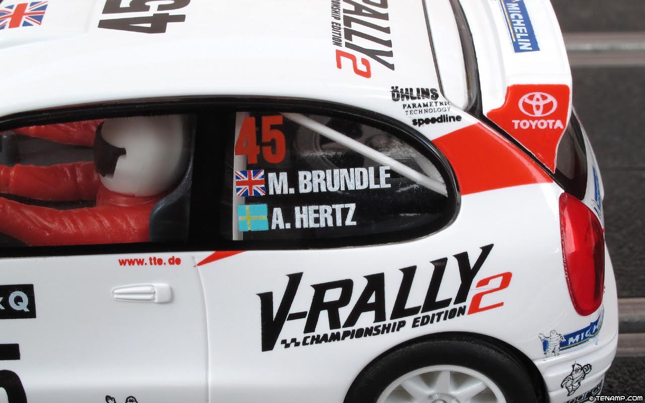 Scalextric model featuring V-Rally 2 branding.