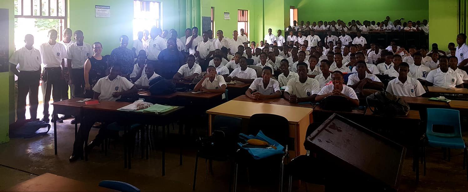Advocacy team and students post a presentation © Abiola Sandiford