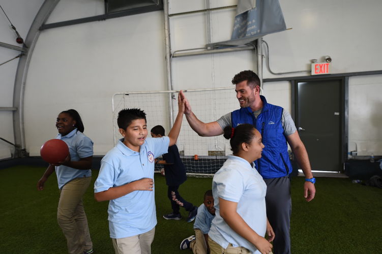 Jesse Palmer and Good Sports met in NYC where a sixth-grade PE class was presented with much-needed equipment.
