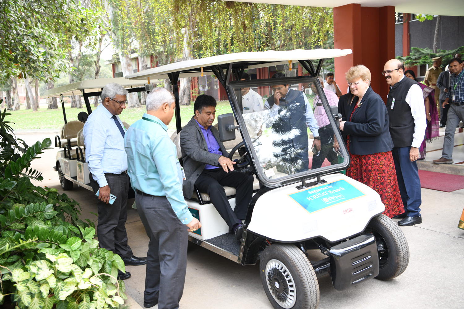 ICRISAT Deputy Director General-Corporate Services, Mr Angshu Sengupta, tests new e-buggies donated by IDBI Bank.