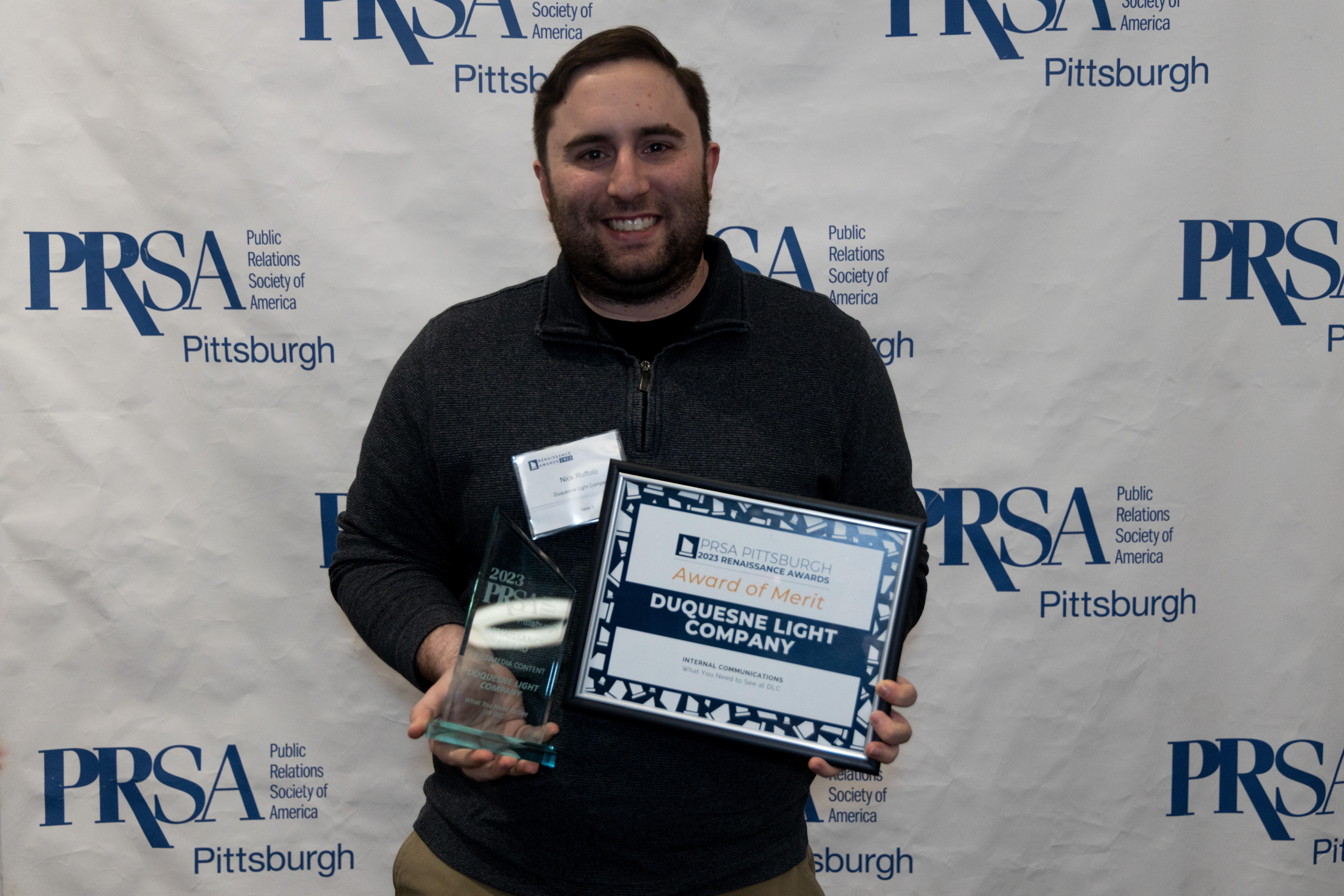 Nick Ruffolo, multimedia associate and host of Duquesne Light Company's internal program "What You Need to See at DLC," accepted the Award of Merit for Internal Communications and the Renaissance Award for Multimedia Communications during the PRSA Pittsburgh Renaissance Awards ceremony at the Carnegie Science Center on Jan. 26.