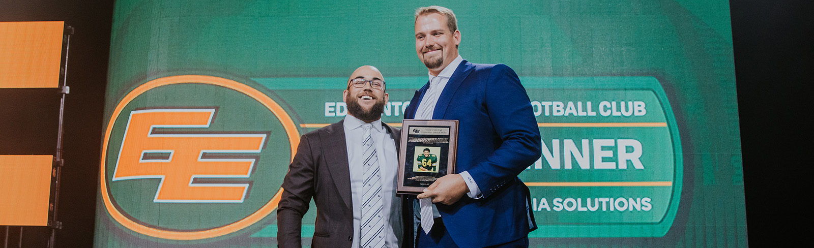 O'Donnell accepting his 2019 David Boone Award from Ryan King, who is also a two-time recipient of the prestigious award. Photo credit: Edmonton Elks.