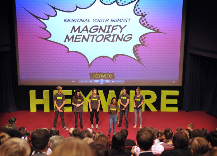 Fitina Maulidi and her Heywire Youth Summit team present their idea, Magnify Mentoring, to fellow Heywire winners. 