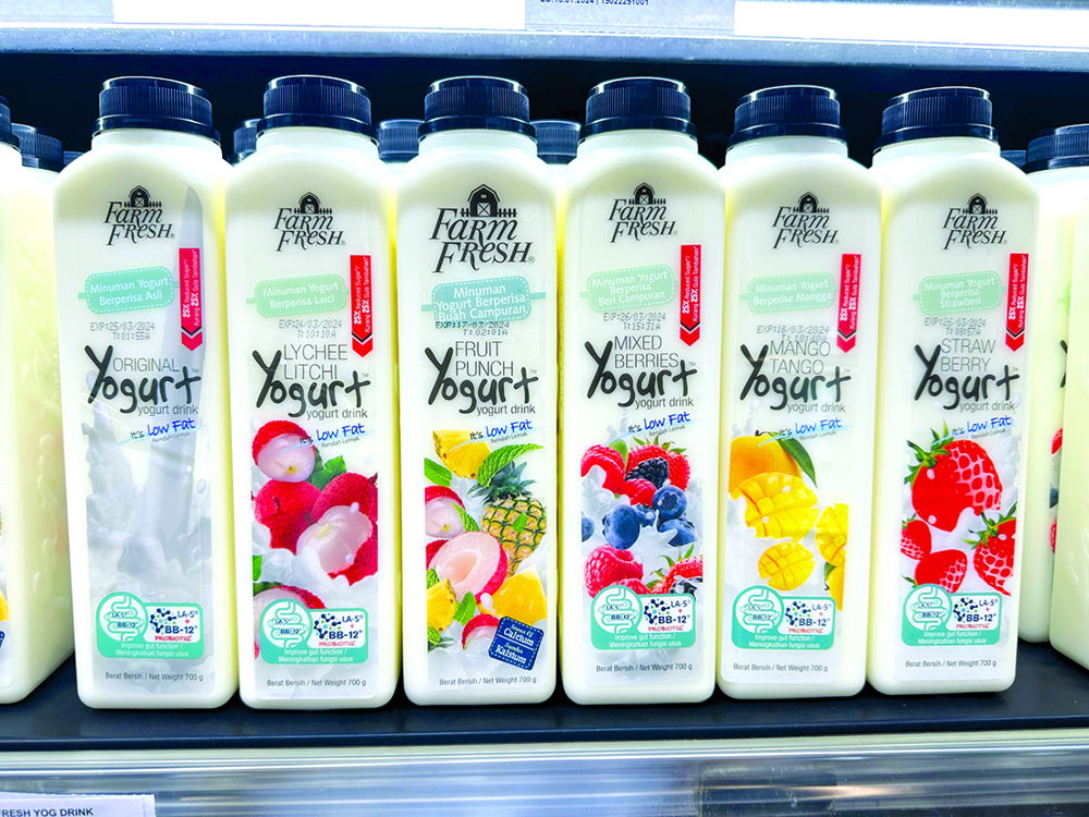 Farm Fresh milk in Jebsen & Jessen Packaging bottles on store shelves.
