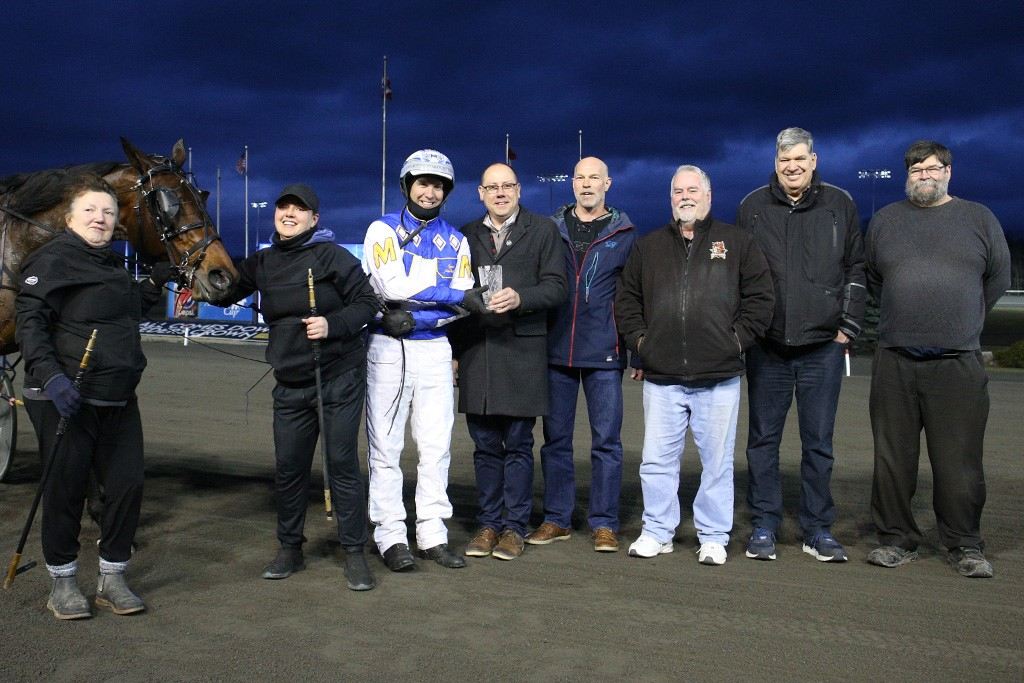 Locatelli is joined by his connections following Saturday's New Holland Trotting Series Final. (New Image Media)