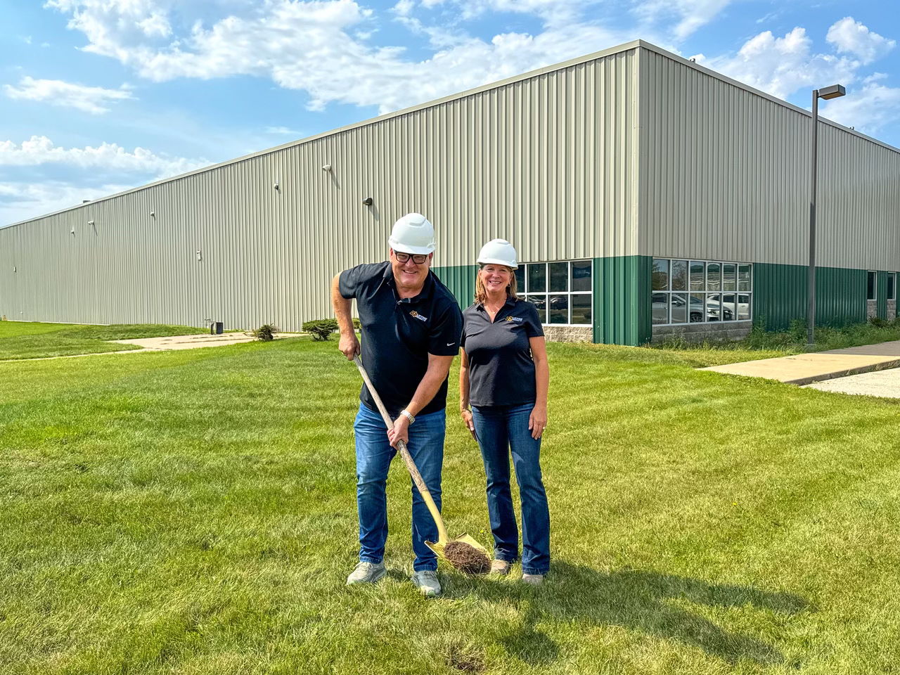 Steve Napieralski, president at OZ Lifting, celebrates groundbreaking at the new facility with his wife, Jane.