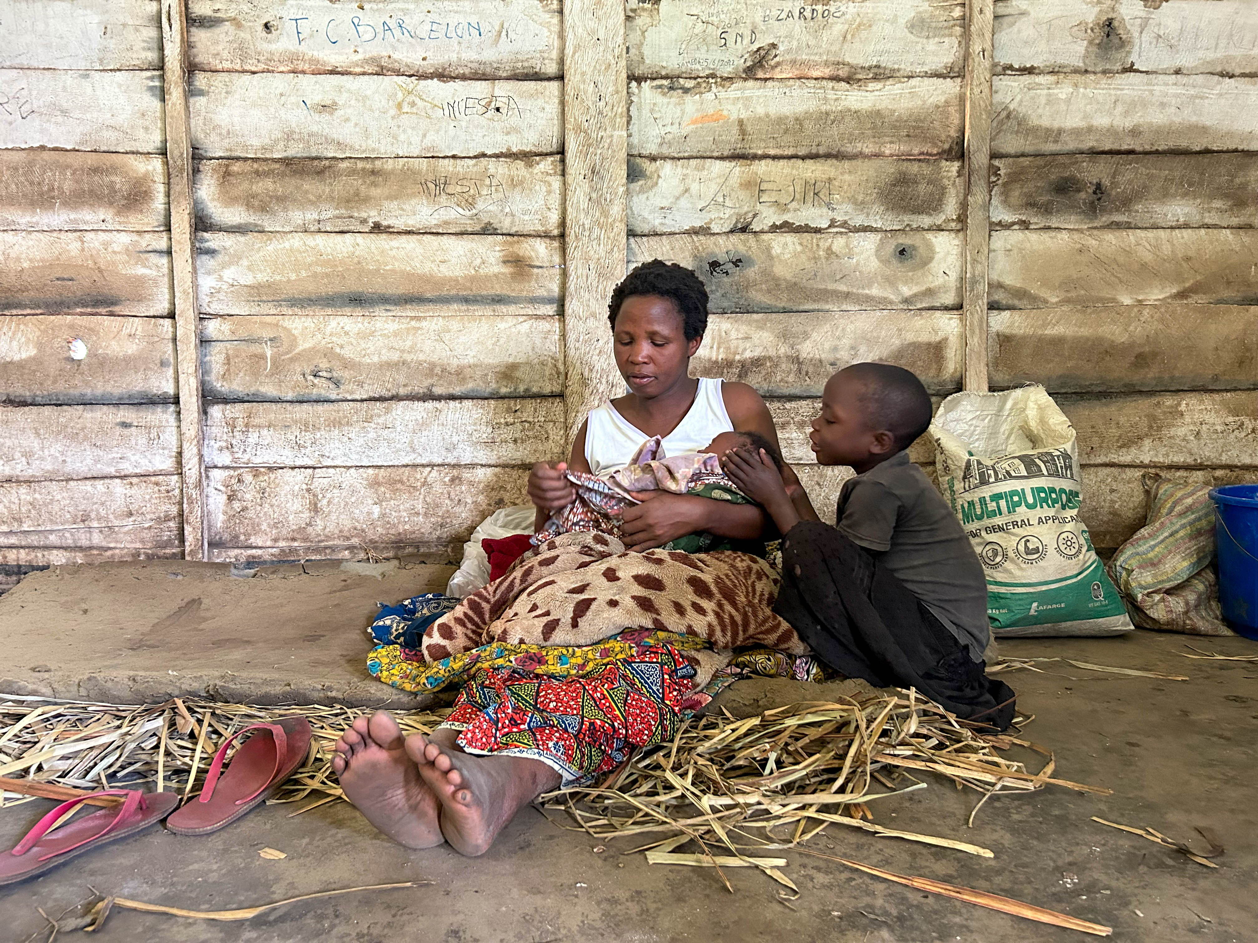 "I'm pregnant, so I wanted to be as close as possible to the hospital". ​ Nirasafari, aged 41, has been taking refuge with her youngest son Dukuze for several weeks in a school in Mweso. ​ "The armed men came to my village in April. My husband was killed, so I fled alone with my youngest son. We took refuge in the bush and then came here. I'm pregnant, so I wanted to be as close as possible to the hospital". ​ Three weeks ago, Nirasafari gave birth to her baby Ishara at the Mweso general referral hospital, supported by MSF since 2005 in collaboration with the Ministry of Health. "My first children have already grown up and started their own families, but Ishara, who has just been born, will never know his father. ​ This is the second time she has fled the fighting. Photographer: Laora Vigourt | DRC | 16/08/2023
