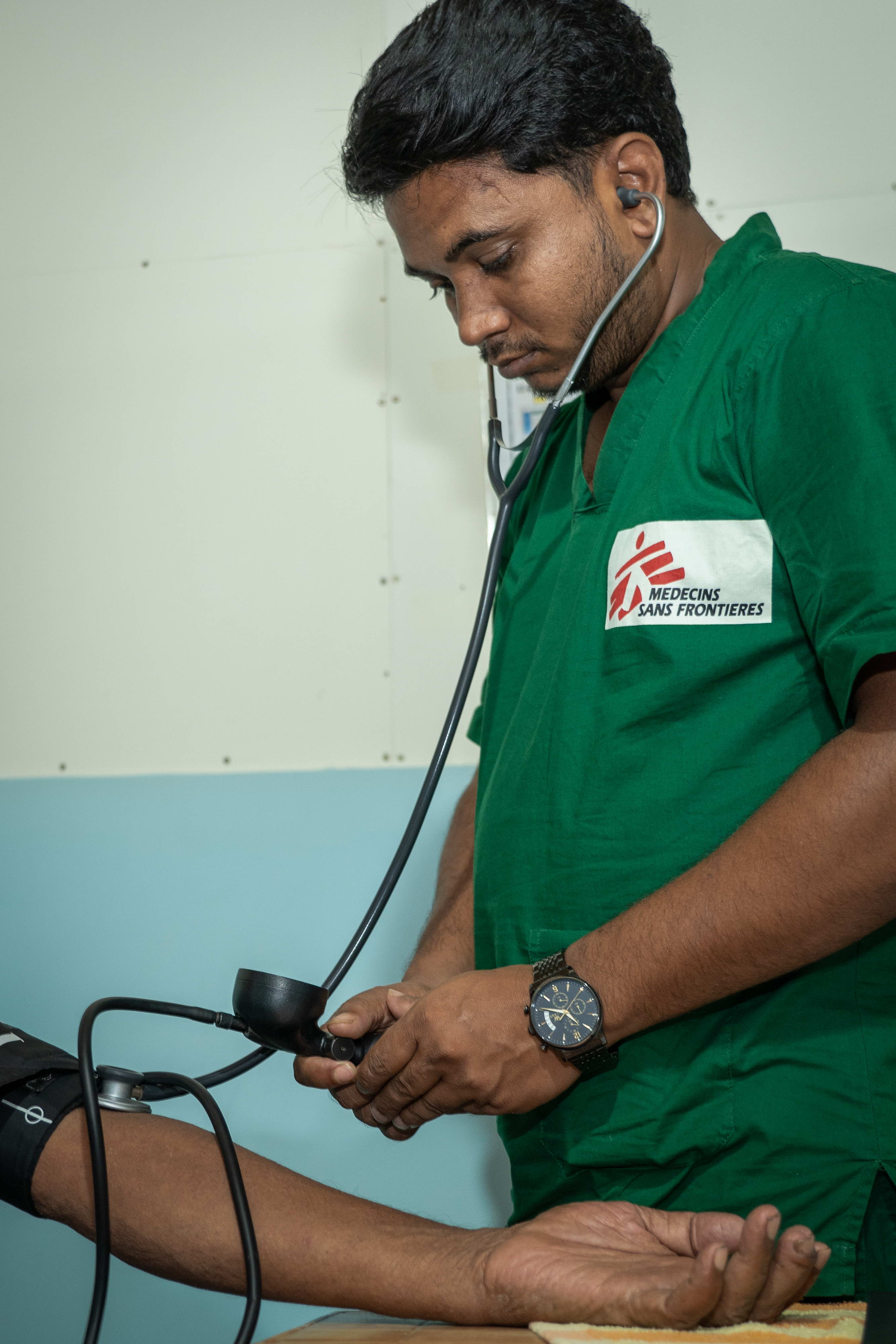 MSF Staff is checking the blood pressure of a Rohingya patient who is visiting MSF’s Jamtoli clinic at the Rohingya refugee camp at Ukhiya, Cox’s Bazar, Bangladesh. | Date taken: 26/05/2024 | Photographer: Abir Abdullah MSF Staff is checking the blood pressure of a Rohingya patient who is visiting MSF’s Jamtoli clinic at the Rohingya refugee camp at Ukhiya, Cox’s Bazar, Bangladesh. | Date taken: 26/05/2024 | Photographer: Abir Abdullah