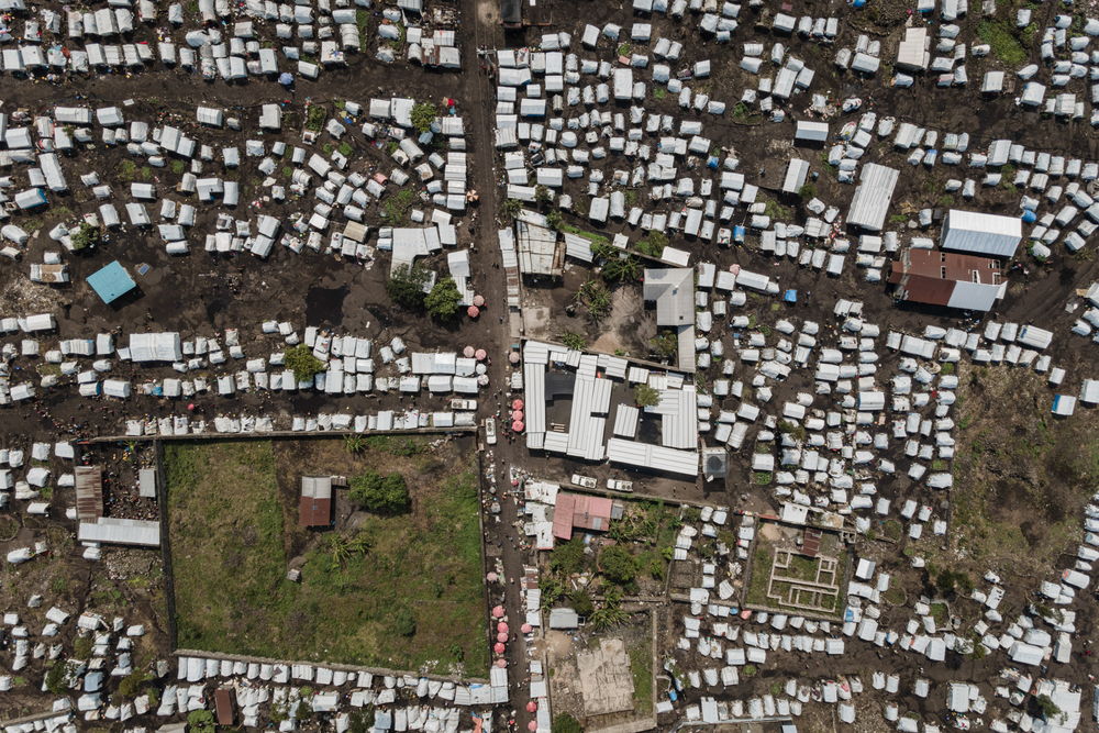 Aerial view of the MSF health facility surrounded by tents, serving as a hub of medical activity and providing care to those affected by the outbreak in the Buhimba displacement site, on the outskirts of Goma. Date taken: 28/08/2024 | Photographer: Michel Lunanga | Location: North Kivu