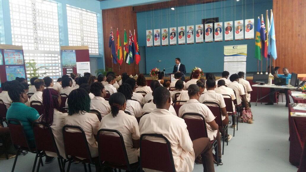 Students listen to a presentation at the ECSC 50th Anniversary Exhibition held in Saint Lucia