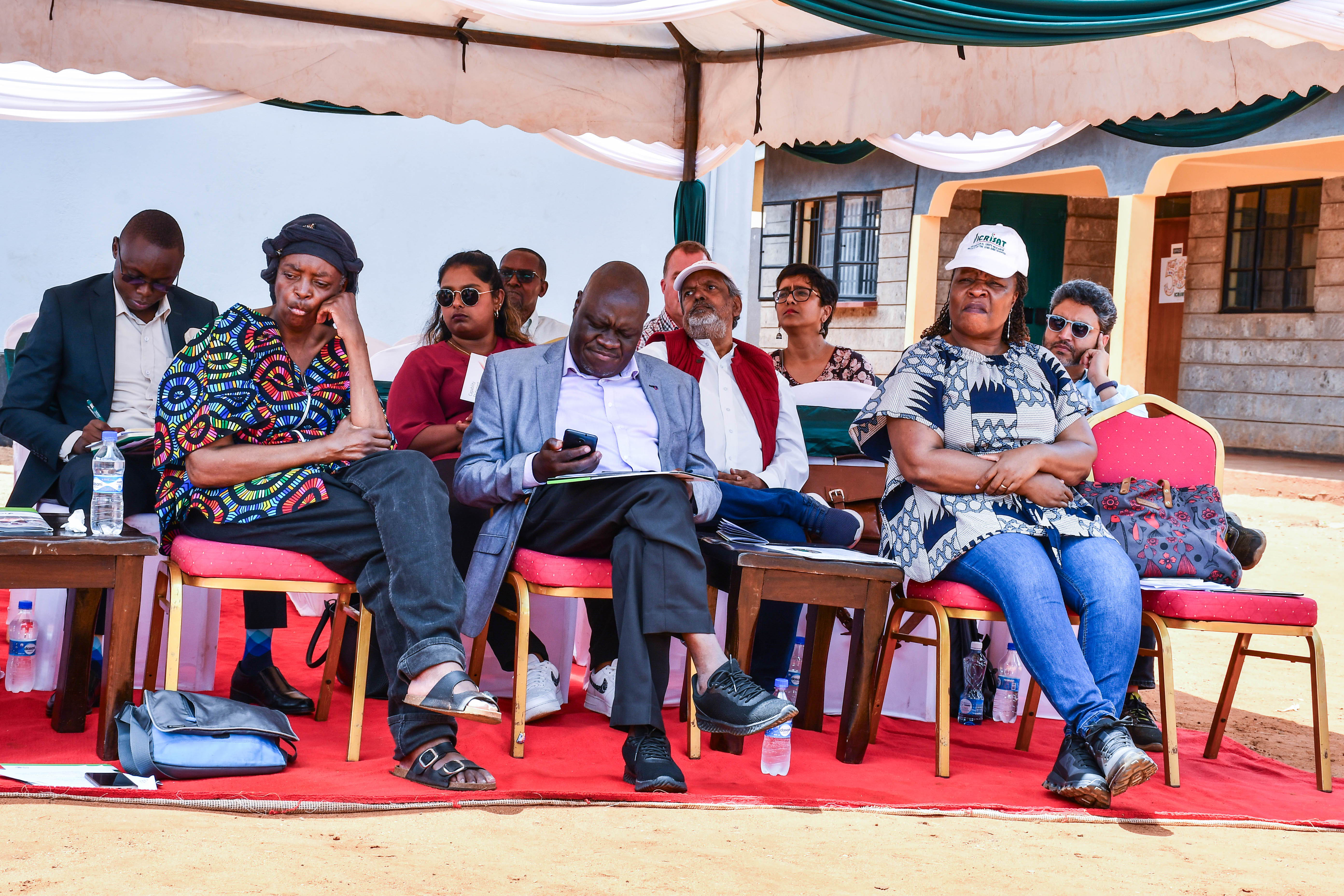 Dr. Lusike( left) the Guest of honor Mr. George Apaka programs lead, agriculture, at Mastercard Foundation (Center) and Dr. Rebbie Harawa, Director of Frica program ICRISAT ​ (Left) at the event