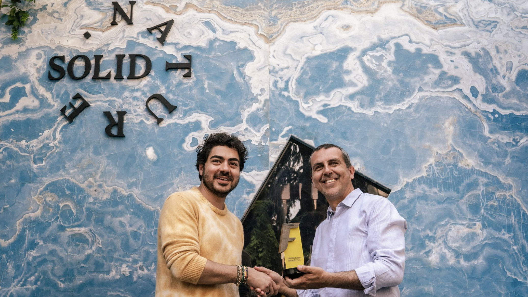 David Mahyari, CEO of SolidNature receiving the Fuorisalone Award and Cristian Confalonieri, Co-Founder of Fuorisalone - Photography by Carla Palini