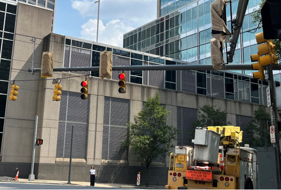 New traffic signals recently installed at Sixth and Centre avenues are covered with a tarp until they’re ready to be put in service