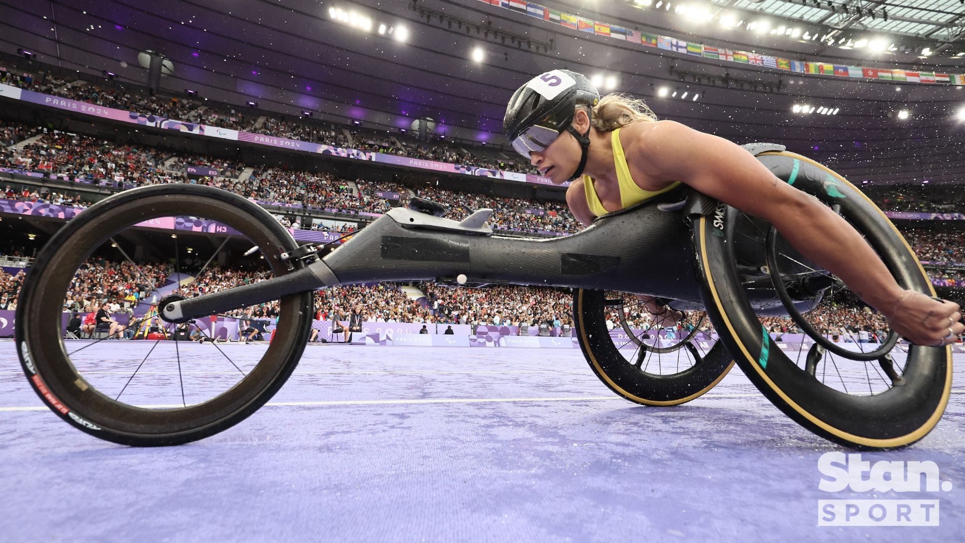 Flagbearer Madi de Rozario is safely into the T54 5000m Final.