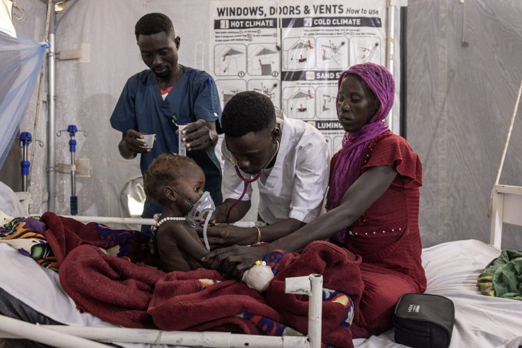 Date taken / Date Recorded: 08 August, 2024 Caption / Description: MSF staff treat a malnourished child at the therapeutic feeding centre at the MSF Hospital in Metche, in eastern Chad, August 8, 2024. Metche camp hosts about 40,000 Sudanese refugees who have fled violence in Darfur. Finbarr O’Reilly/VII Photo.