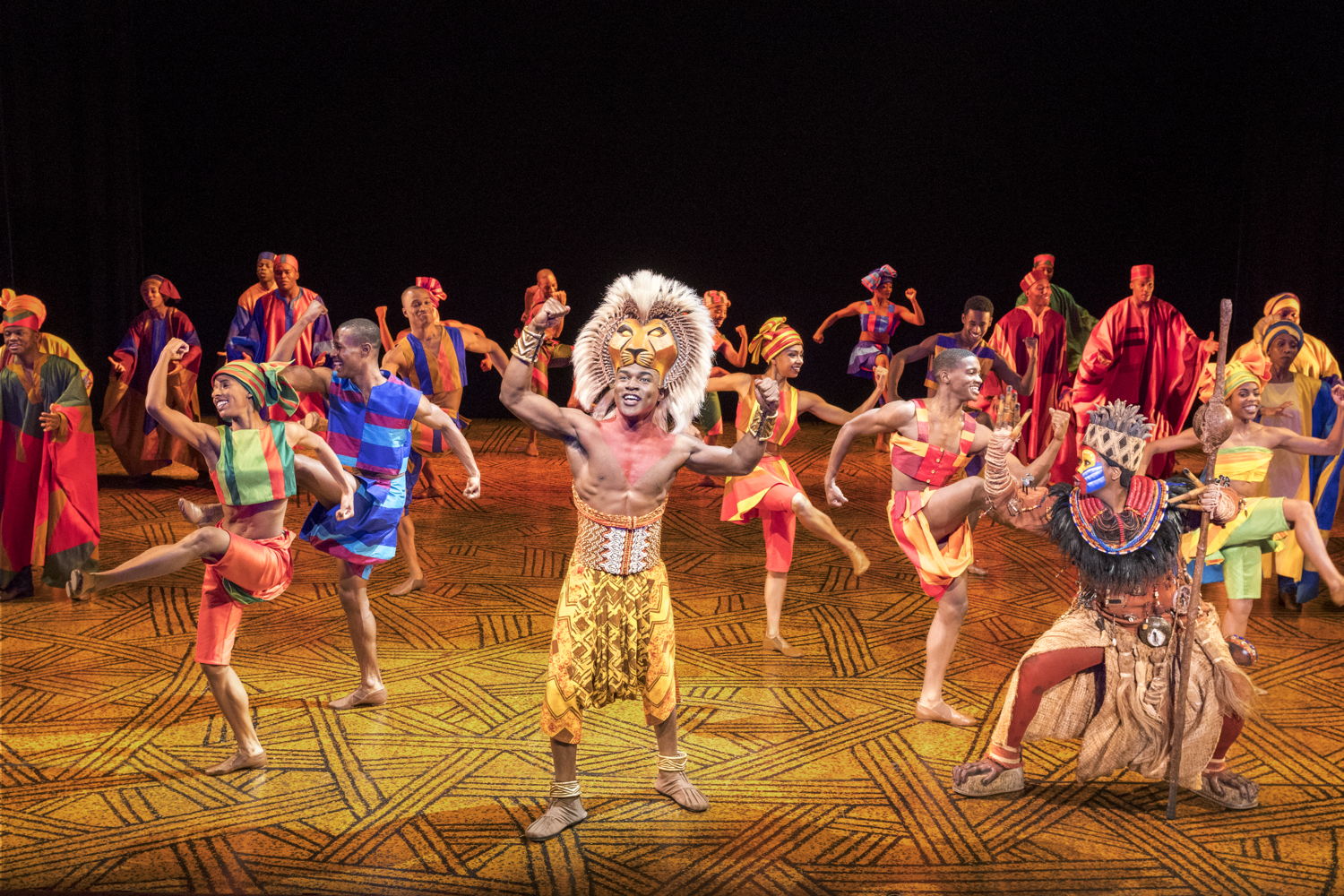 Gerald Caesar as “Simba” and Company in THE LION KING North American Tour. ©Disney.  Photo by Deen van Meer