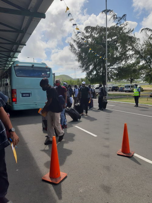 Farm workers from the OECS prepare for departure to Canada.