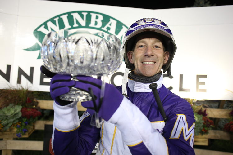 David Miller poses with the Mohawk Million crystal trophy. (New Image Media)