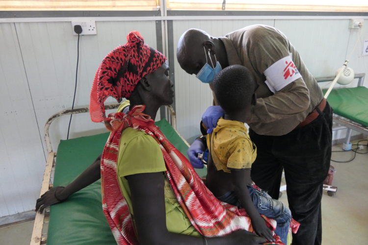 Kang Gatlok, 4 years old, during a medical consultation. Days before reaching the hospital, he tested positive for malaria. Despite receiving medication, fever persisted and his urine became dark. Then his mother decided to take him to the MSF hosptial in Bentiu camp where he was diagnosed with hepatitis E. Copyright: Damaris Giuliana/MSF