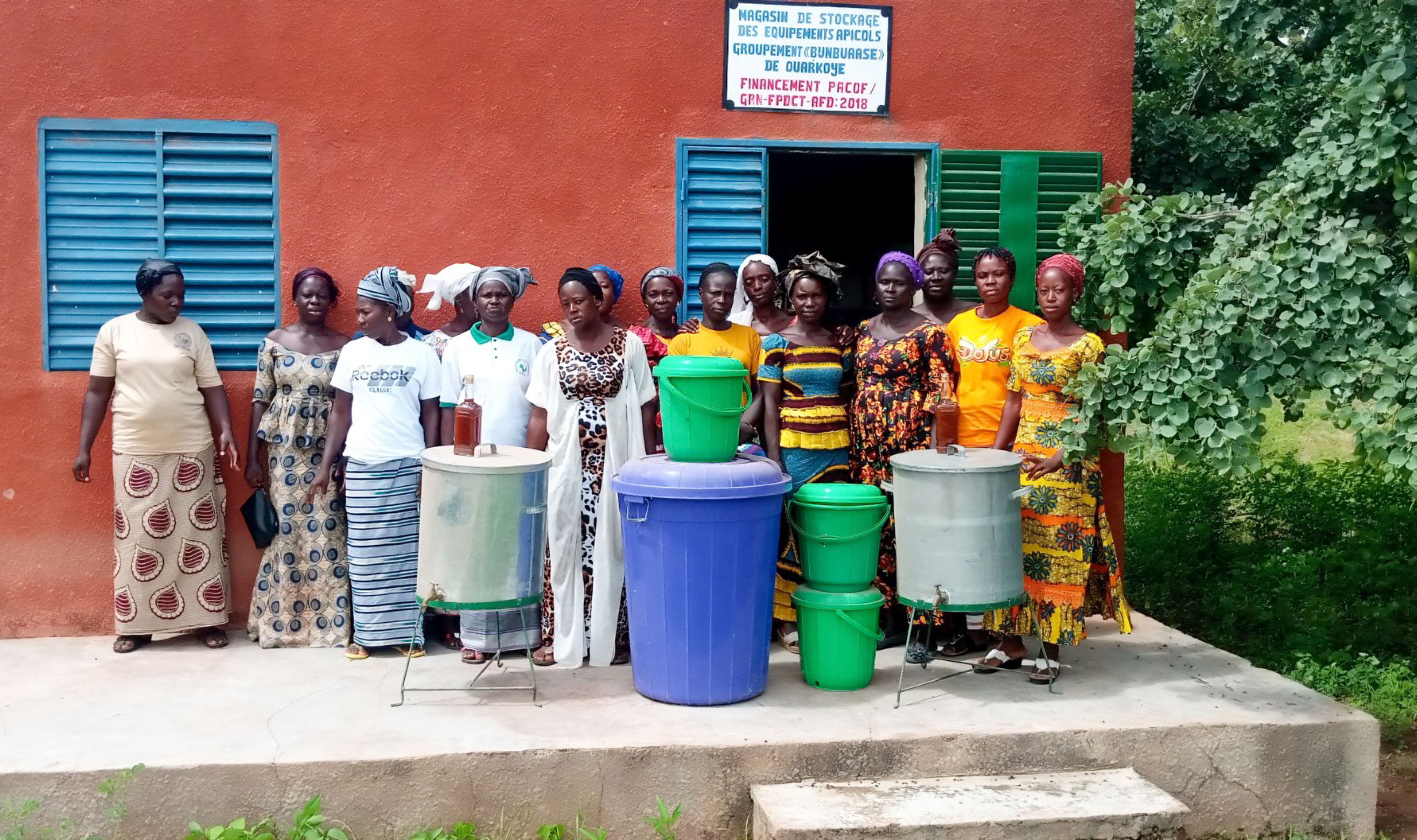 Women stand in front of their association headquarters in Burkina Faso