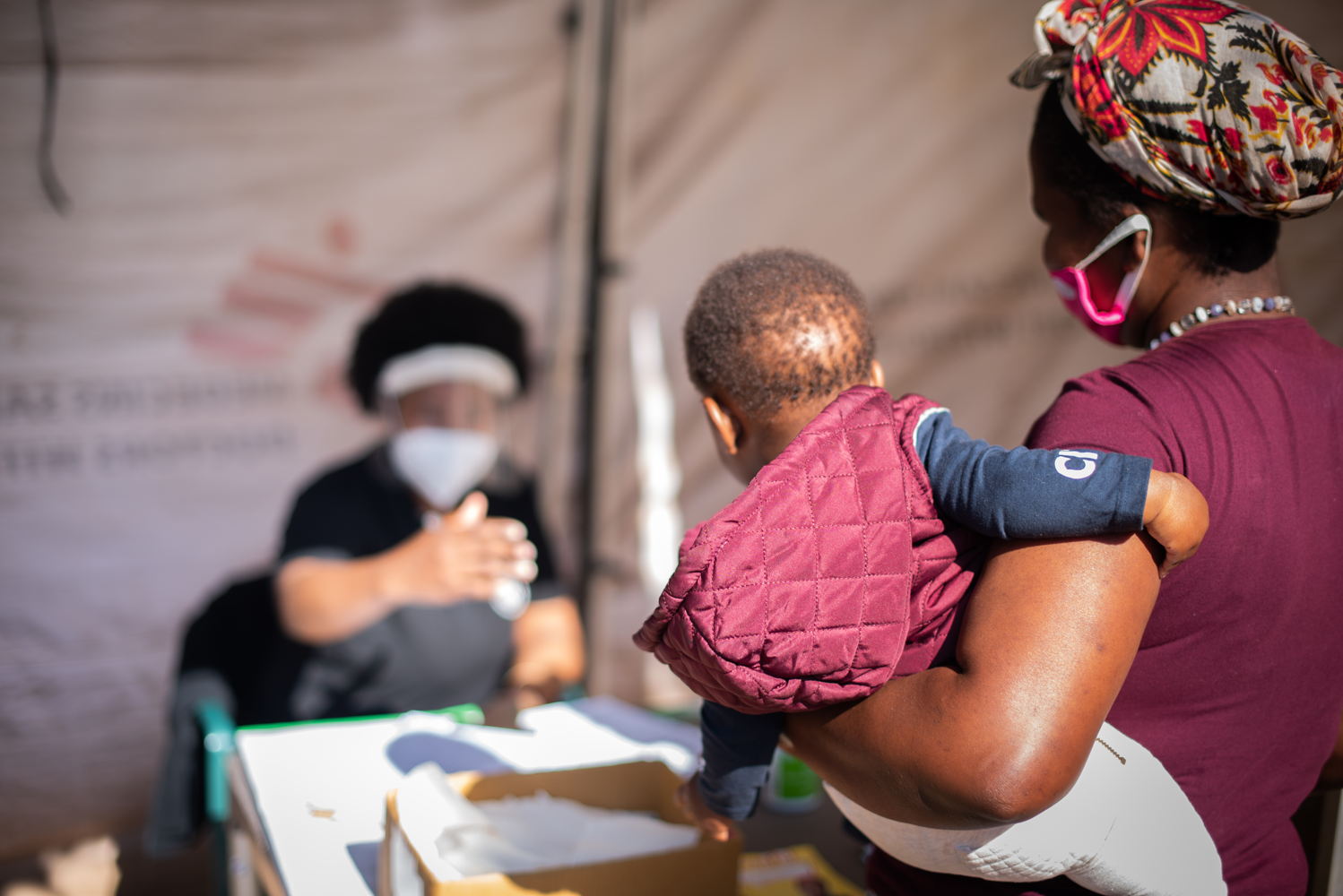In Eshowe in South Africa’s KwaZulu-Natal Province, MSF assisted the department of health with establishing help desks outside clinics - triage points where all who wish to enter are screened using a screening tool, and possible COVID-19 patients are then referred to a separate tent for testing. Photographer: Chris Allan