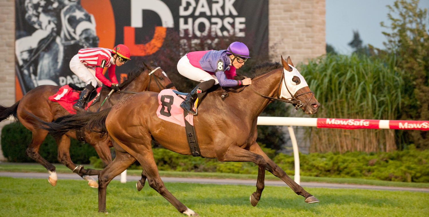 Ron's Gizmo and jockey Emma-Jayne Wilson winning Race 13 on August 20, 2023 at Woodbine (Michael Burns Photo)