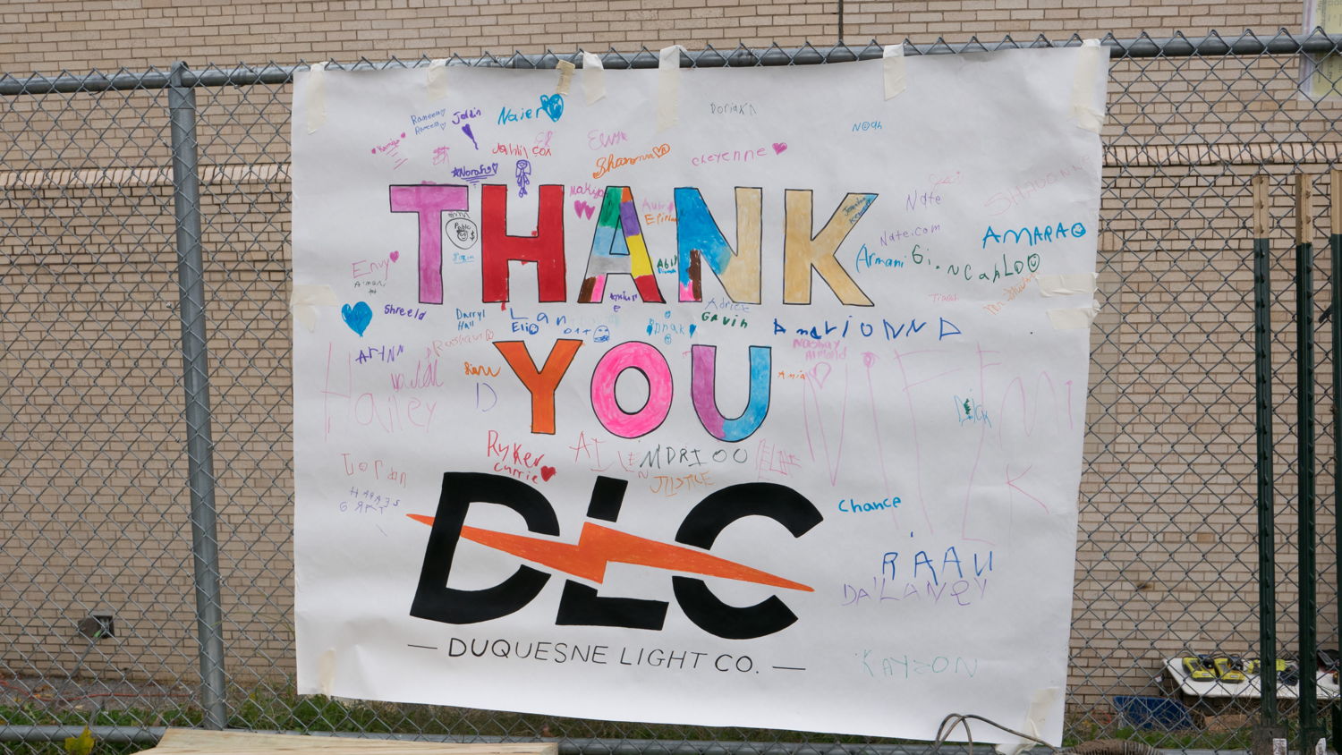 Students at Edgewood Elementary STEAM Academy made a sign thanking the DLC employee volunteers.