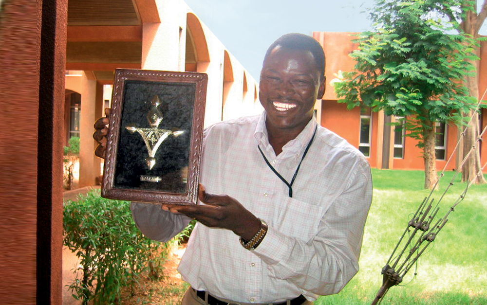 Dr Ramadjita Tabo proudly displays Nobel Peace Prize.