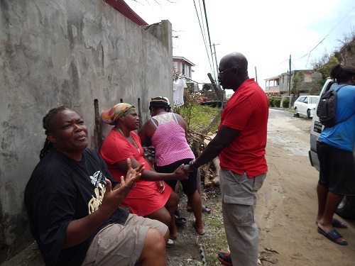 Grenada's Ambassador to the OECS H.E Dr. Patrick Antoine meets residents of Dominica as part of the relief mission to assist affected residents

Photo credit: Janeka Simon