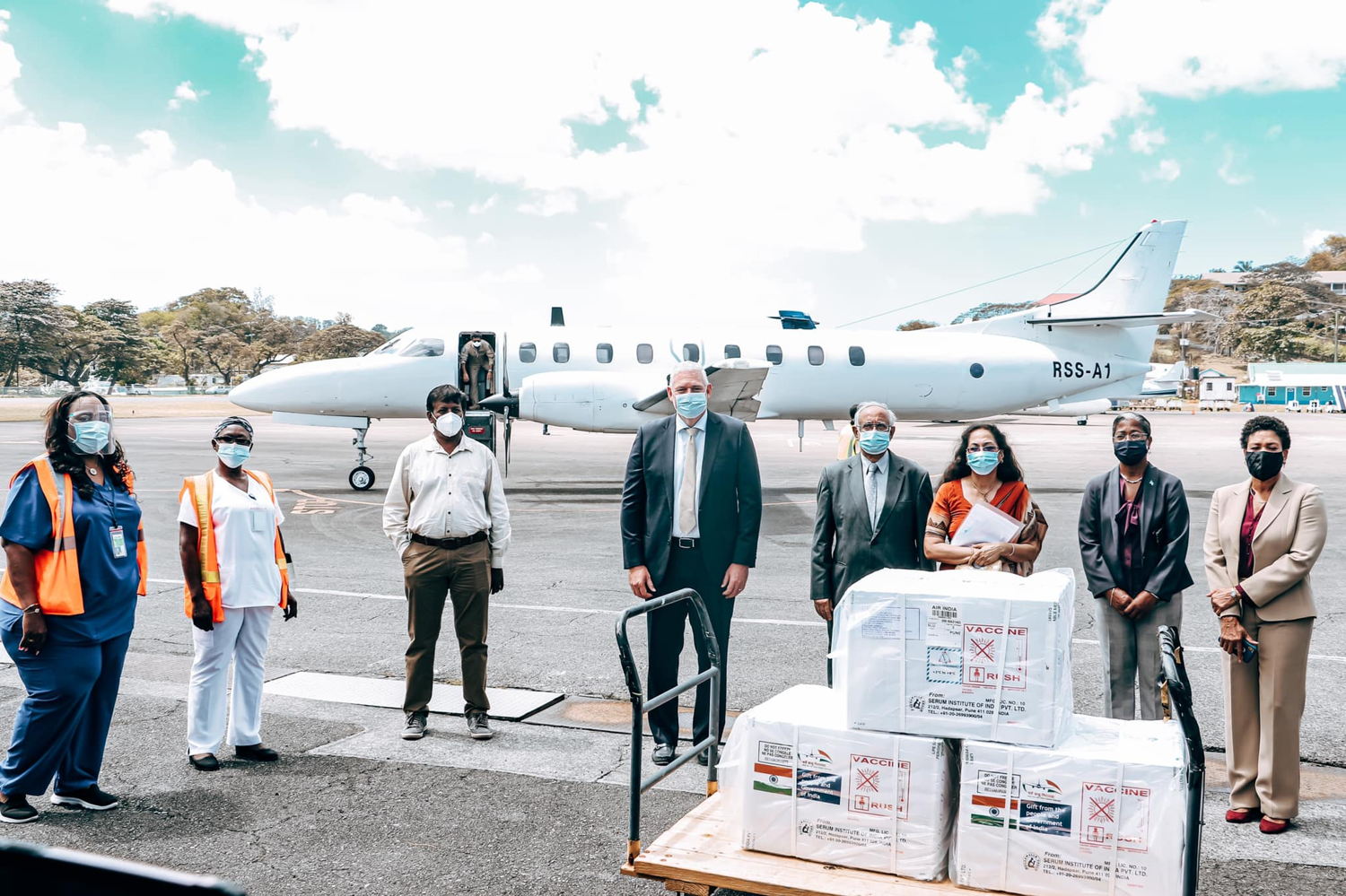 Prime Minister Hon. Allen Chastanet receiving the shipment of vaccines in Saint Lucia.