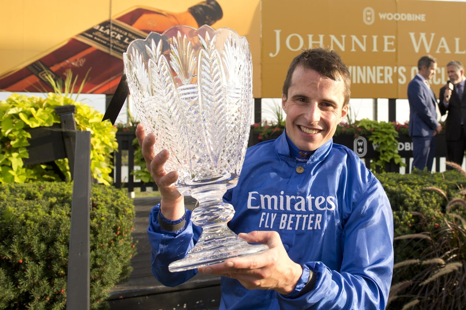 William Buick poses with the Ricoh Woodbine Mile trophy. (Michael Burns Photo)