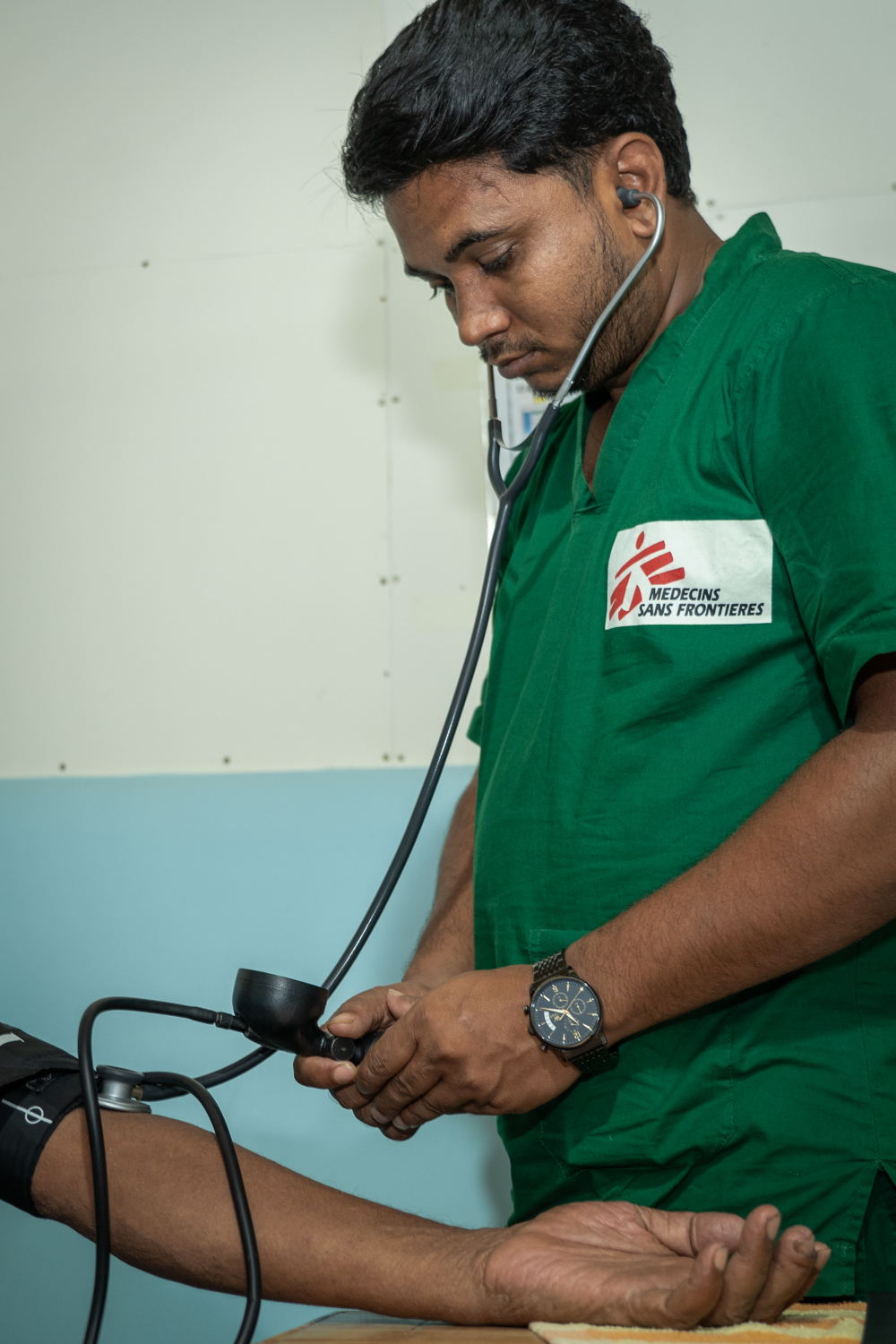 MSF Staff is checking the blood pressure of a Rohingya patient who is visiting MSF’s Jamtoli clinic at the Rohingya refugee camp at Ukhiya, Cox’s Bazar, Bangladesh. | Date taken: 26/05/2024 | Photographer:Abir Abdullah: MSF Staff is checking the blood pressure of a Rohingya patient who is visiting MSF’s Jamtoli clinic at the Rohingya refugee camp at Ukhiya, Cox’s Bazar, Bangladesh. | Date taken: 26/05/2024 | Photographer:Abir Abdullah: