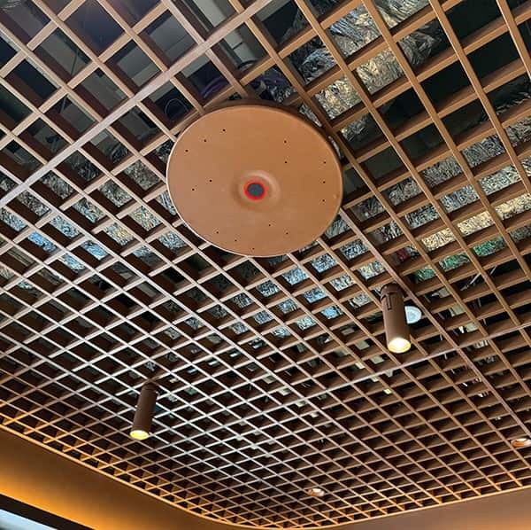 An example of the TCC Ms colour match to the waffle ceiling cover, bringing together design and function to the meeting room.