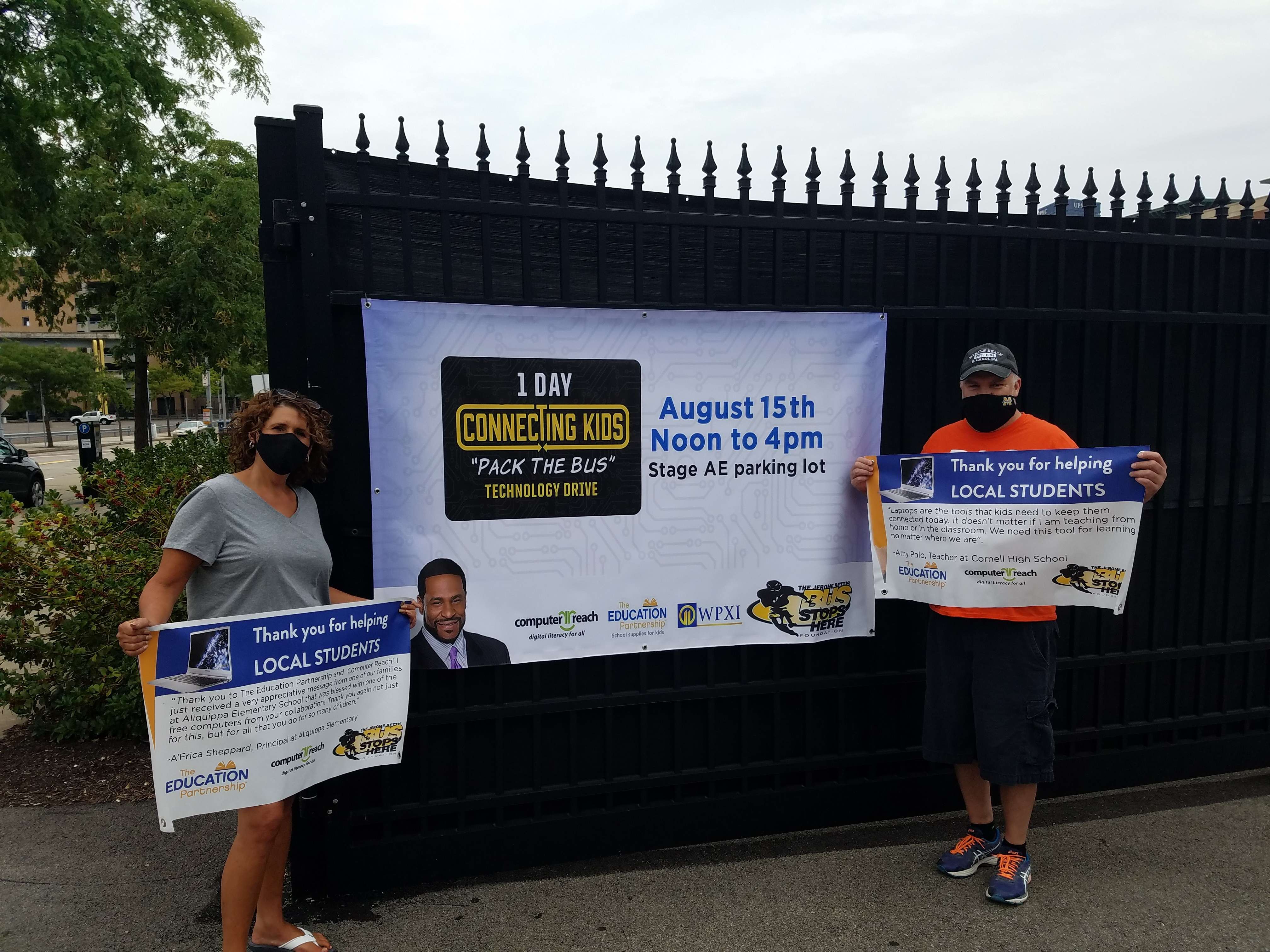 Diane Lloyd, workforce development supervisor, and Kevin Baden, AMI field services supervisor, were among the DLC employee volunteers at the “Connecting Kids” technology drive on Saturday, Aug. 15.