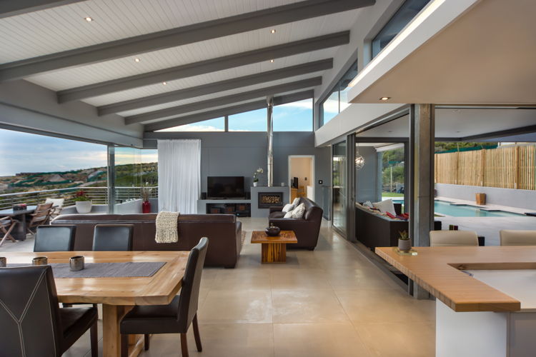 This brand new four bedroom, four bathroom Avenue Home at Chapman’s Bay Estate offers its occupants spacious and light-filled accommodation as well as spectacular views of the valley, mountains and ocean. The use of huge glass panels means that from the wind-protected, north courtyard, one is able to look right through the house to the southern views beyond.