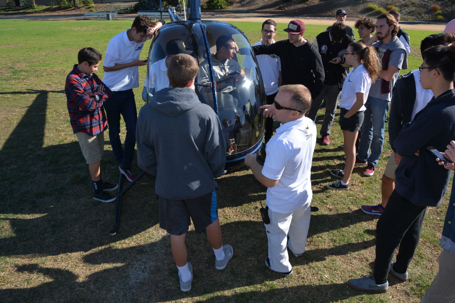 Revolution Aviation landed a helicopter on the Canyon High School field and then explained helicopters to the students while they took turns sitting in the cockpit.