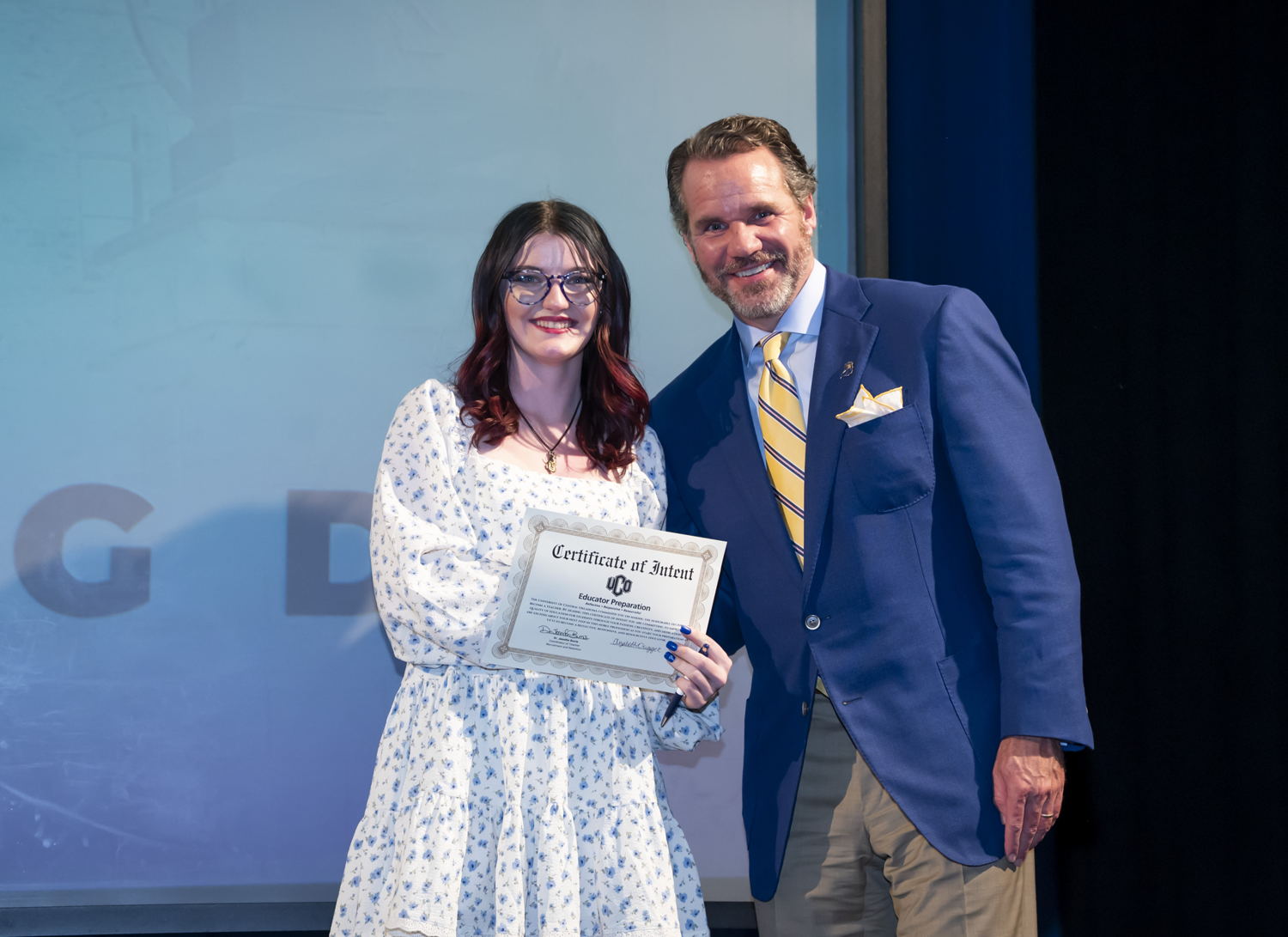 A student poses with UCO President Todd G. Lamb at Teacher Signing Day.