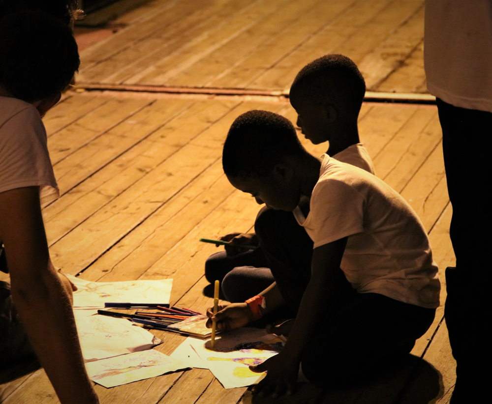 Children drawing on the deck of Ocean Viking.
Copyright: Hannah Wallace Bowman/MSF