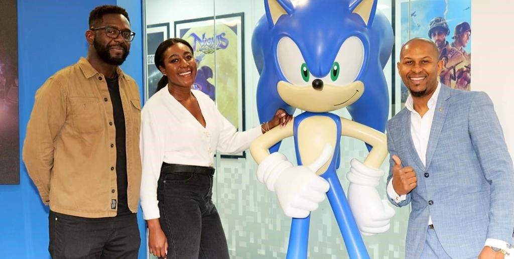 Left to right, SEGA Europe's Jide Agbalaya and Charlene Strachan, and The Safety Box's, Nathaniel Peat at the contract signing for this event. 
