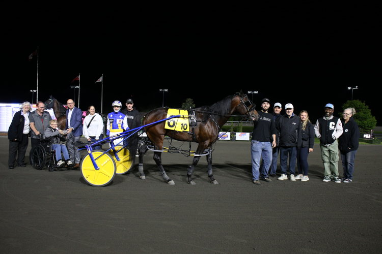 Nijinsky and connections after winning the second division of the first leg of the Graduate Series for four-year-old pacers on May 31, 2025 at Woodbine Mohawk Park (New Image Media)