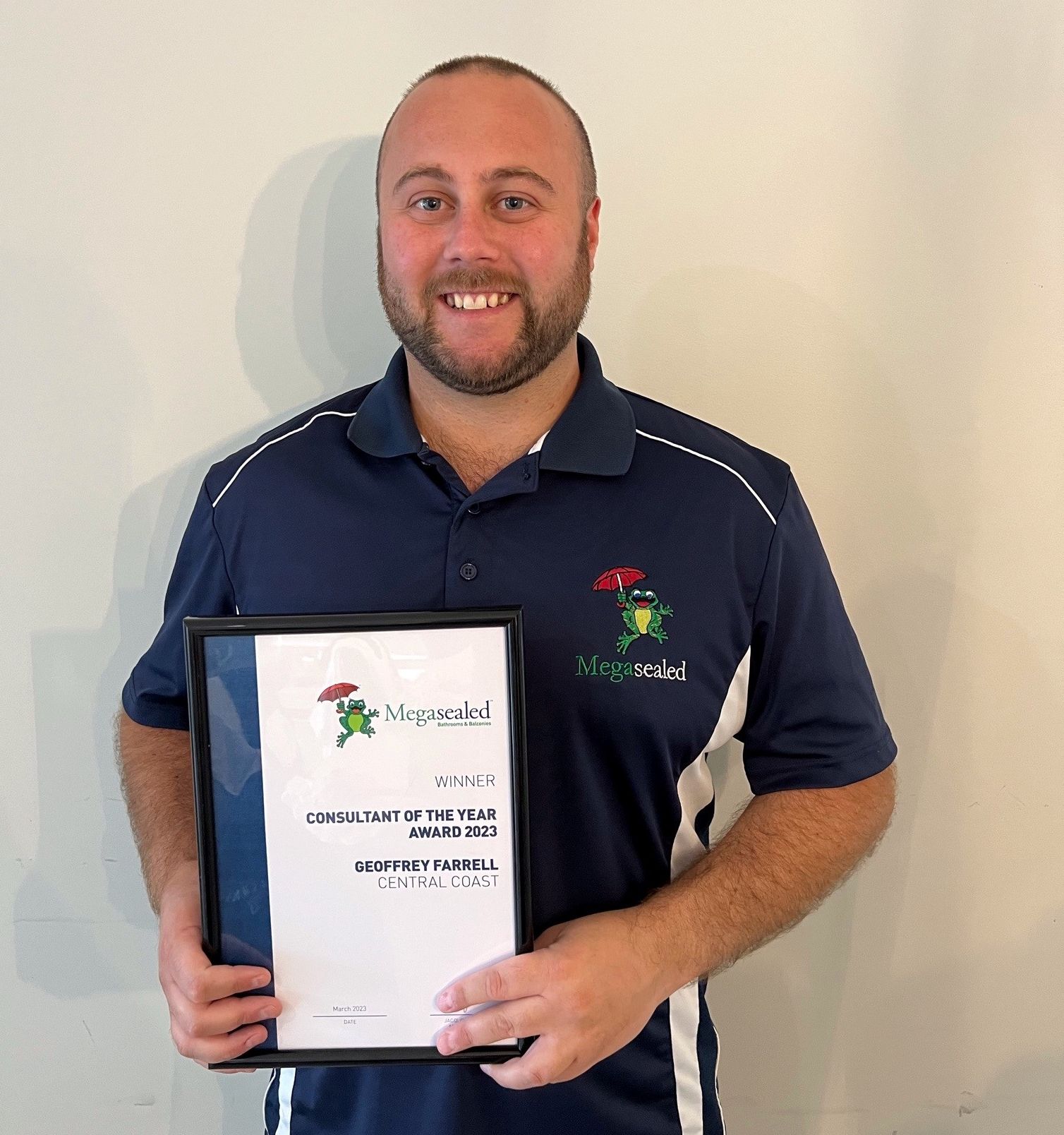 Megasealed Central Coast Consultant Geoffery Farrell holding his award.