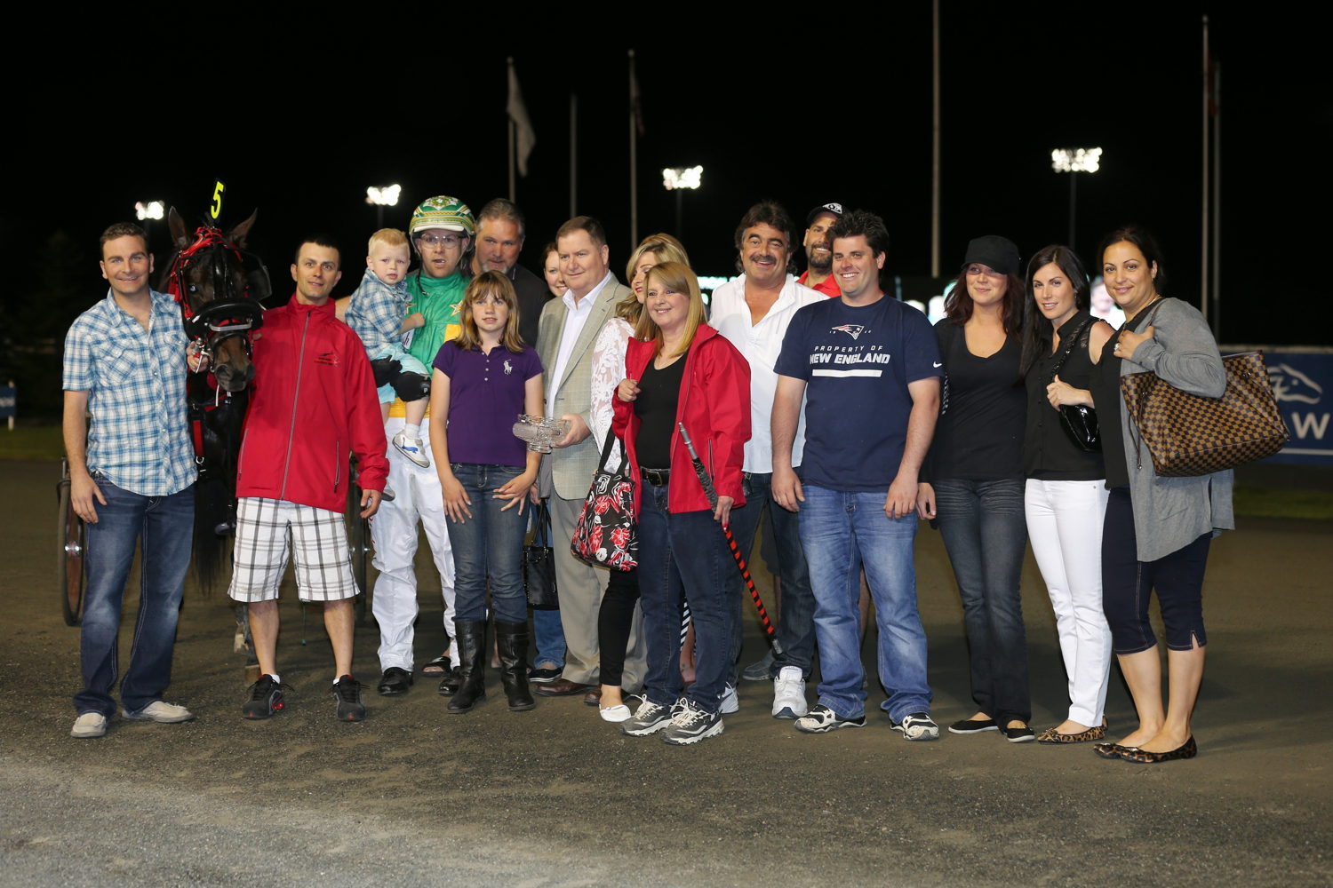 Hes Watching and connections in the Somebeachsomewhere winners circle on May 31, 2014 at Woodbine (New Image Media)