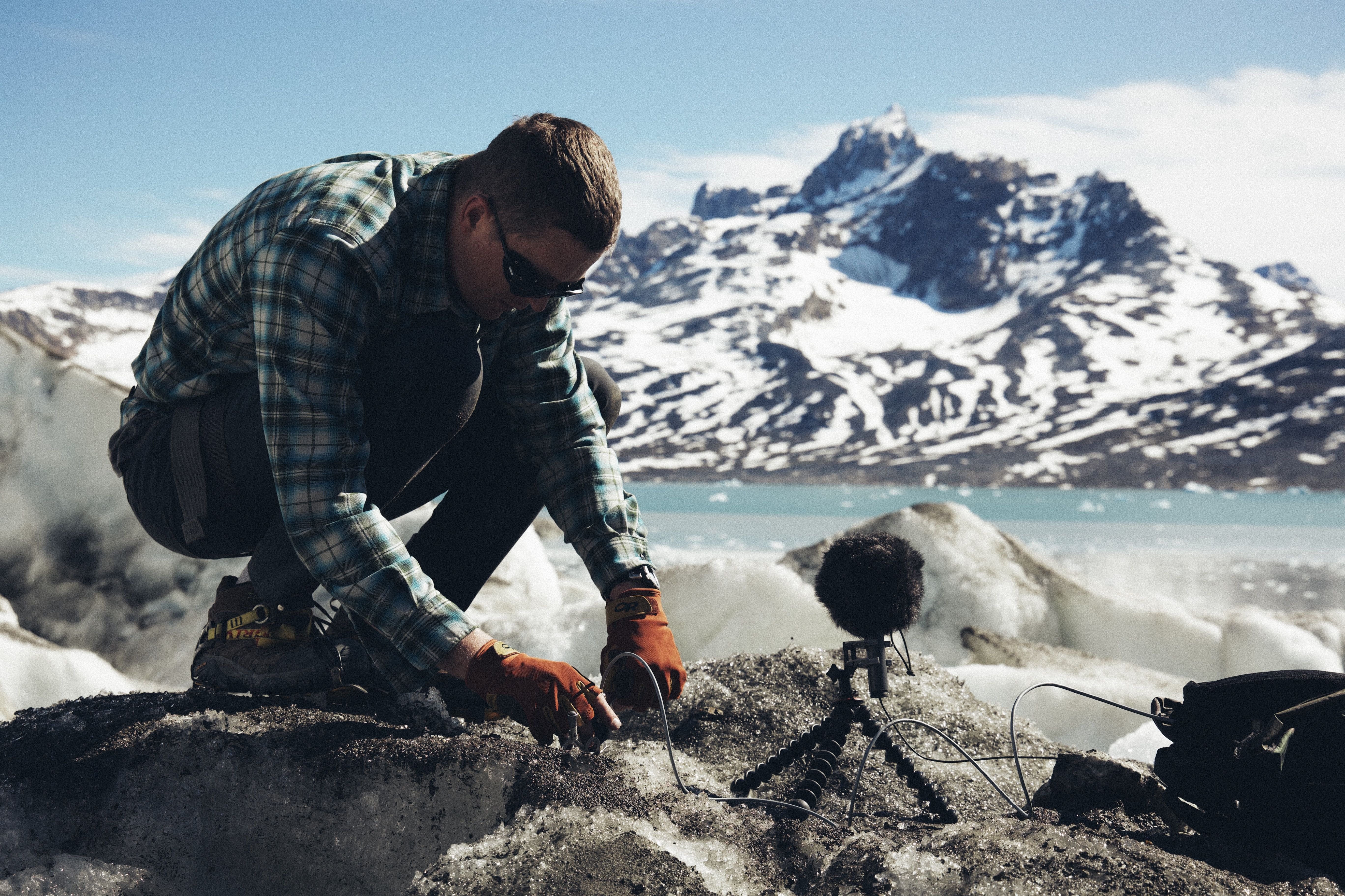 Setting up an MKH 8020 and a recorder on a glacier ​ ​ (Picture courtesy of Thomas Rex Beverly)