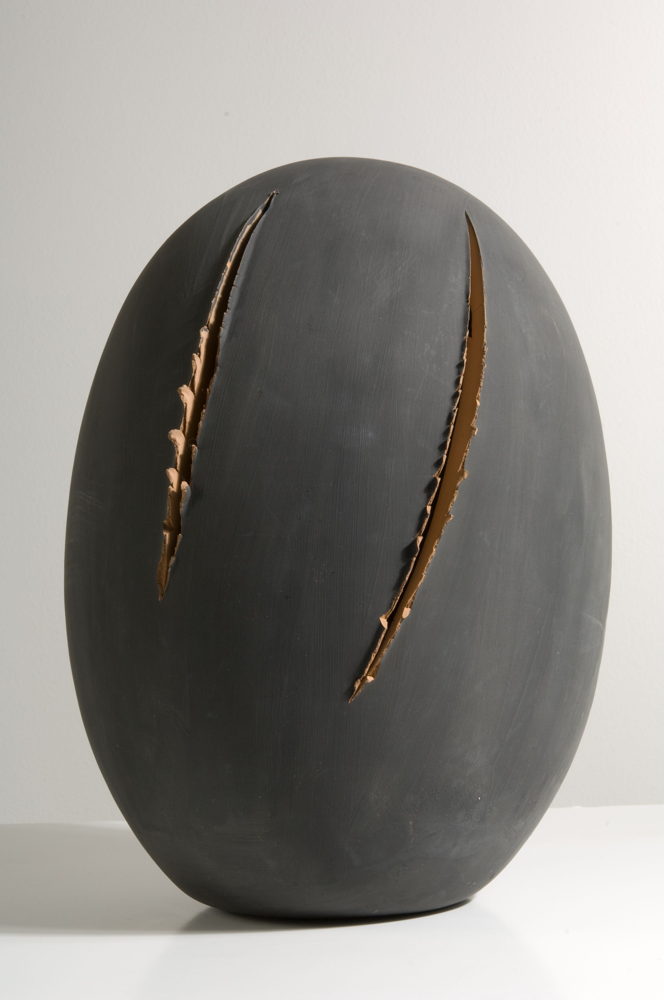 Lucio Fontana, Concetto spaziale [Spacial Concept], 1961 – 1962, Slipped terracotta and cuts, 38 x 28.5 cm / 15 x 11 1/4 in © Fondazione Lucio Fontana by SIAE 2022