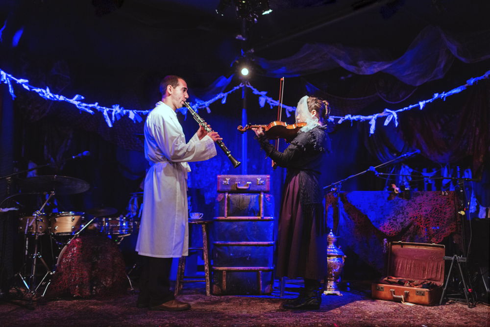 Eric Da Costa (Chaim, woodwinds) and Shaina Silver-Baird (Chaya, violin) in Old Stock: A Refugee Love Story / Photos by Jamie Kronick / Louisa Adamson & Christian Barry – Set & Lighting Design | Carly Beamish - Costume Design